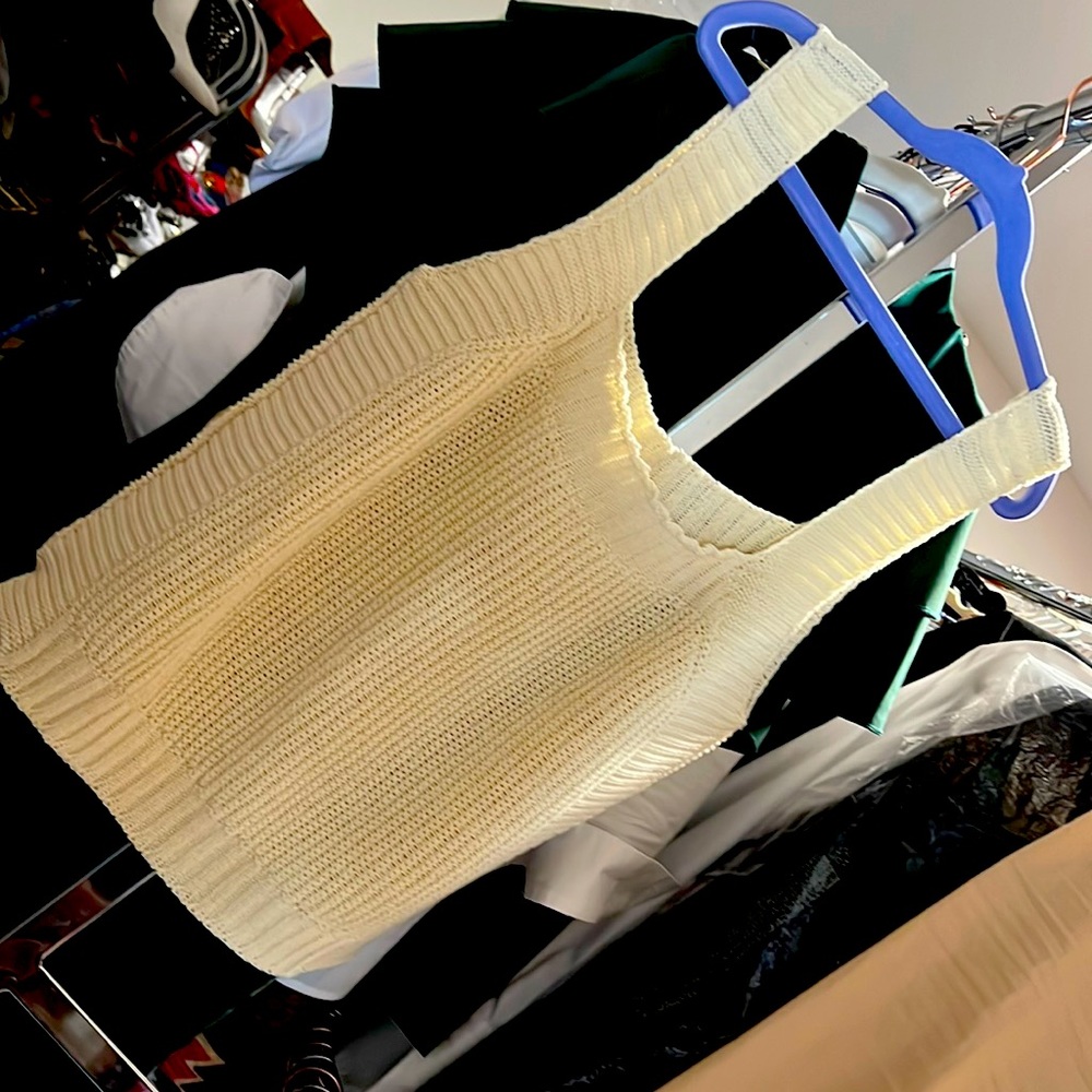 Small sweater top fits like a Med to Large great to wear under suit or with pant